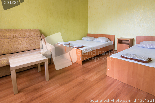 Image of Interior of the room of a budget hotel with two beds