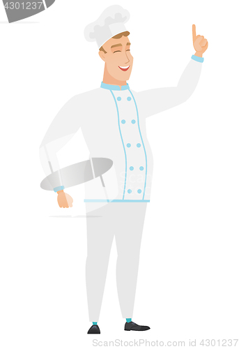 Image of Caucasian chef cook pointing with his forefinger.