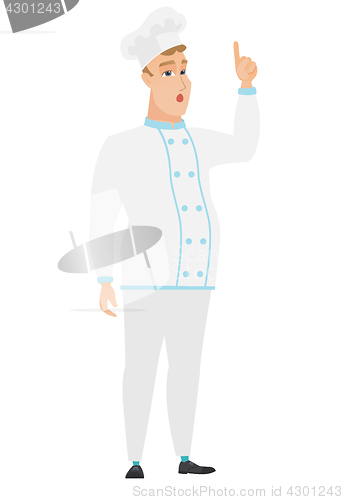 Image of Chef cook with open mouth pointing finger up.