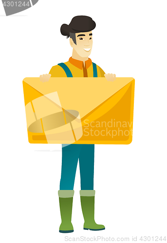 Image of Smiling farmer holding a big envelope.