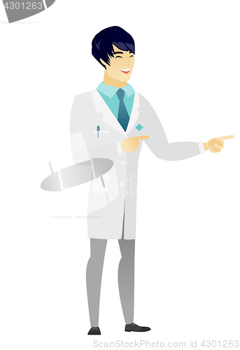 Image of Young asian doctor pointing to the side.