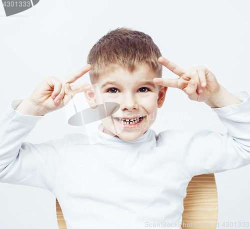 Image of little cute adorable boy posing gesturing cheerful on white background, lifestyle people concept 