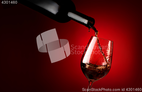 Image of Wineglass on a red background