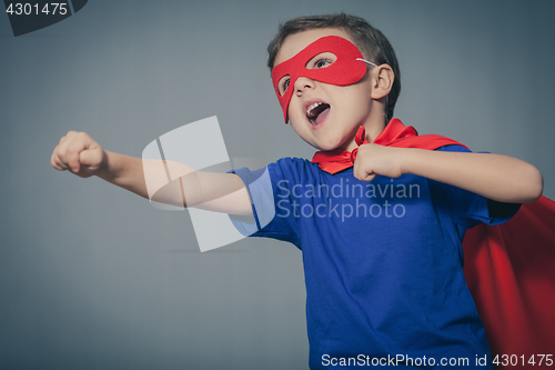 Image of Happy little child playing superhero.