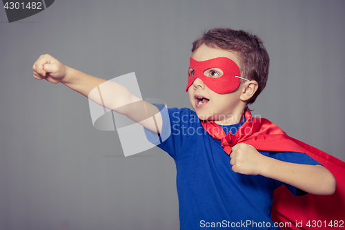 Image of Happy little child playing superhero.