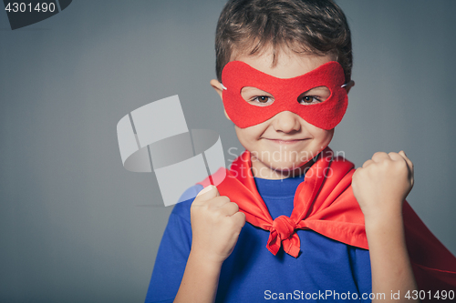 Image of Happy little child playing superhero.