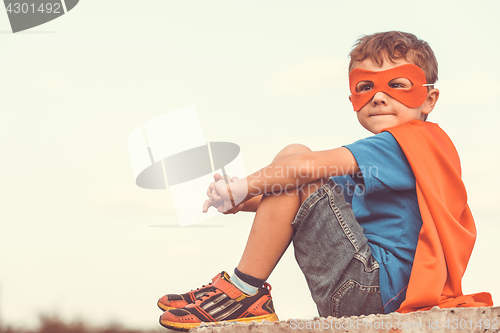 Image of Happy little child playing superhero.