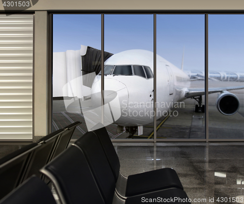 Image of window in empty airport at morning