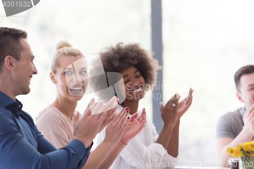 Image of multiethnic startup Group of young business people celebrating s