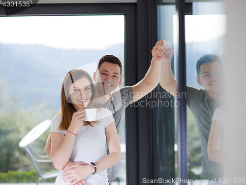 Image of young couple enjoying morning coffee