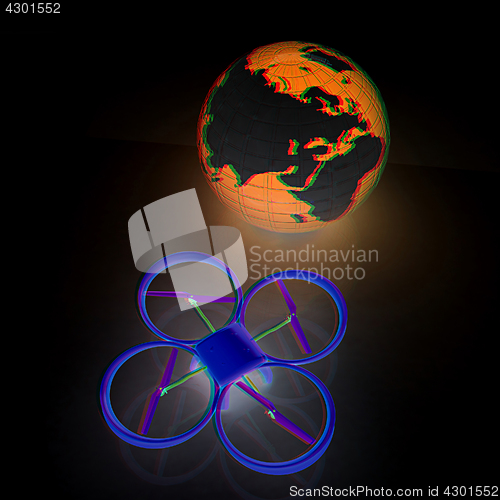 Image of Quadrocopter Drone with Earth Globe and remote controller on a w