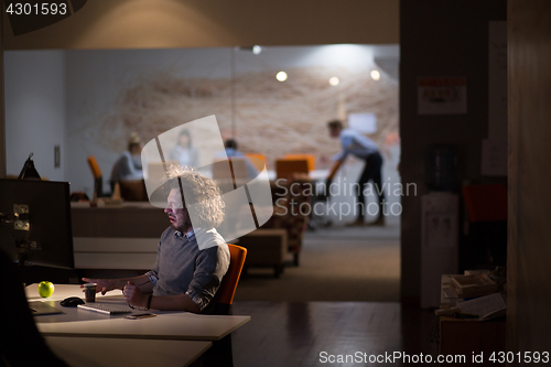 Image of Tired businessman working late