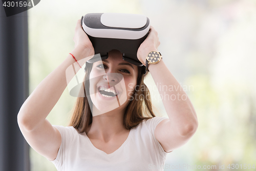 Image of woman using VR-headset glasses of virtual reality