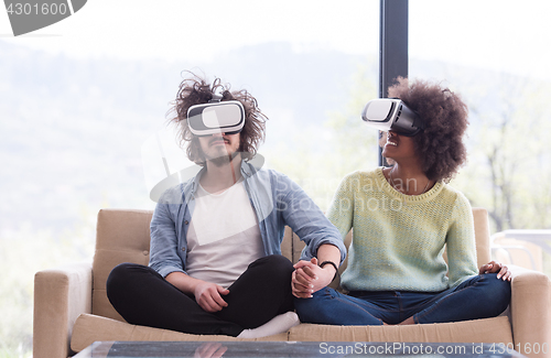 Image of Multiethnic Couple using virtual reality headset