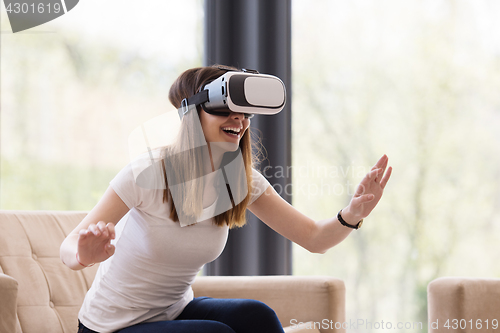 Image of woman using VR-headset glasses of virtual reality