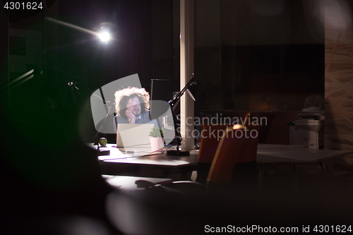 Image of businessman relaxing at the desk