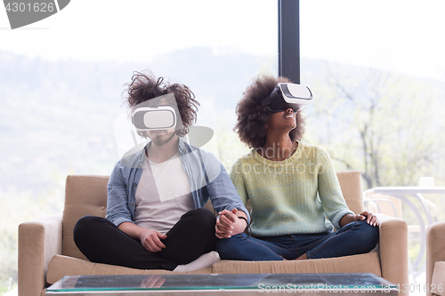 Image of Multiethnic Couple using virtual reality headset