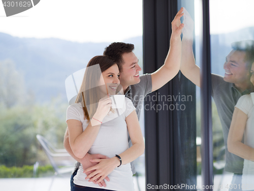 Image of young couple enjoying morning coffee