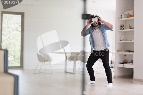 Image of man using VR-headset glasses of virtual reality