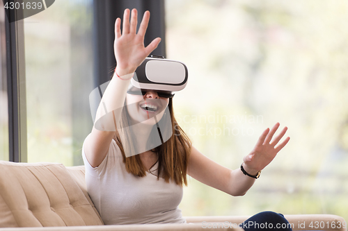 Image of woman using VR-headset glasses of virtual reality