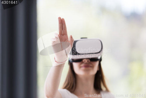 Image of woman using VR-headset glasses of virtual reality