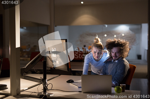 Image of young designers in the night office
