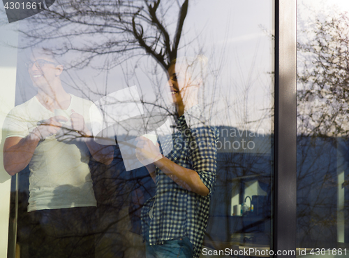 Image of young couple enjoying morning coffee
