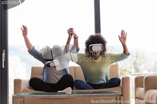 Image of Multiethnic Couple using virtual reality headset