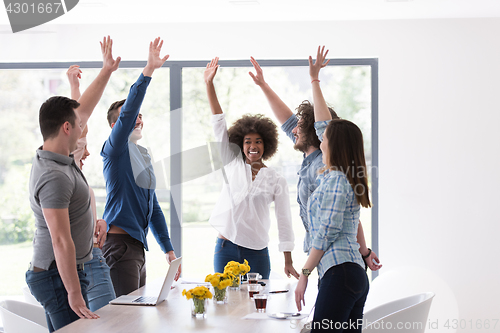 Image of multiethnic startup Group of young business people celebrating s