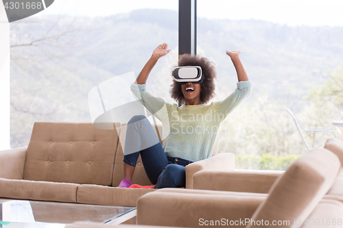 Image of black woman using VR headset glasses of virtual reality