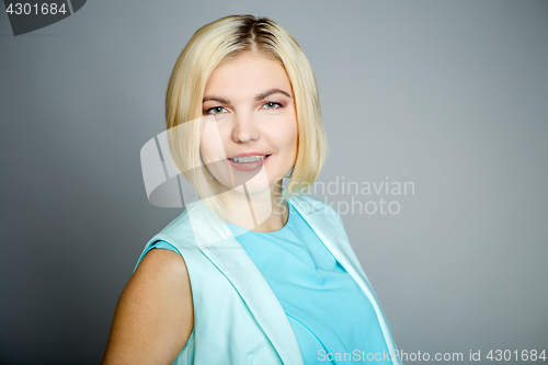 Image of Smiling blonde on empty background