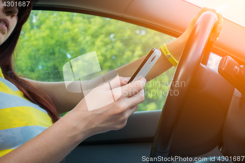 Image of Photo of brunette with phone