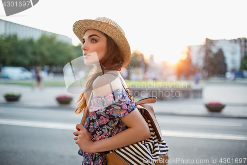 Image of The fashion woman portrait of young pretty trendy girl posing at the city in Europe