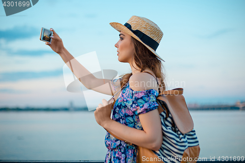 Image of Young woman and river at city