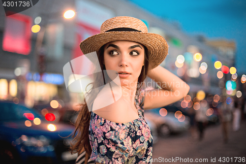 Image of The fashion woman portrait of young pretty trendy girl posing at the city in Europe