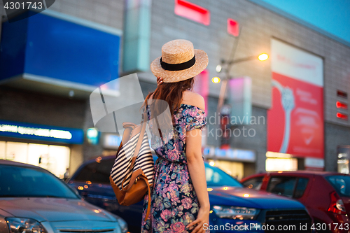 Image of The fashion woman portrait of young pretty trendy girl posing at the city in Europe