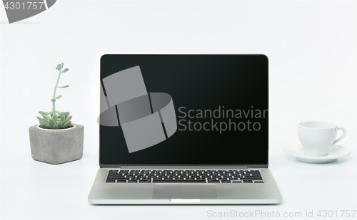 Image of The front view of notebook and cup of coffee. Inspiration and mock-up concept