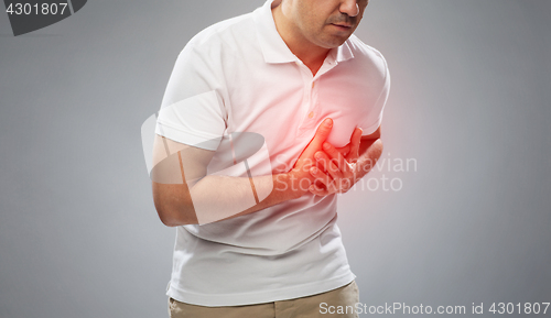 Image of close up of man suffering from heart ache