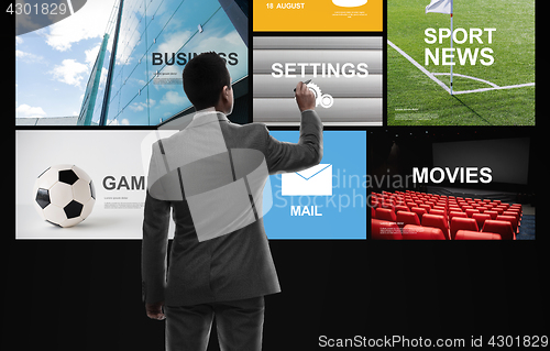 Image of businessman working with news applications