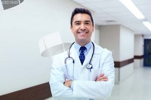Image of smiling doctor in white coat at hospital