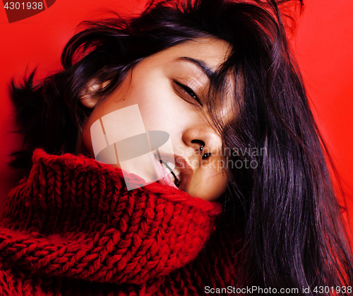 Image of young pretty indian mulatto girl in red sweater posing emotional, fashion hipster teenage, lifestyle people concept 