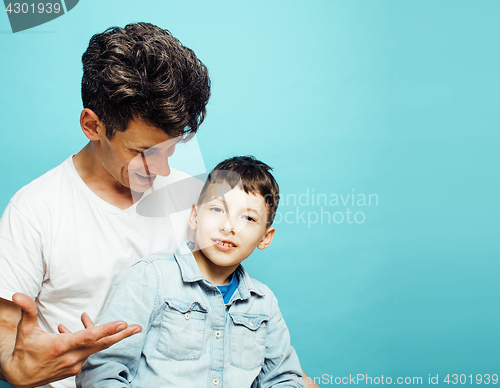 Image of young pretty man model with little cute son playing together, lifestyle modern people concept, family male 