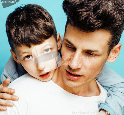 Image of young pretty man model with little cute son playing together, lifestyle modern people concept, family male 