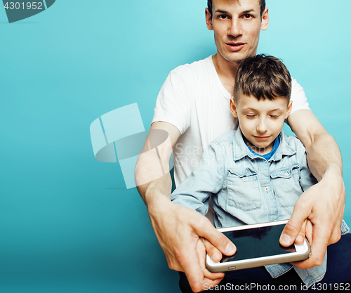 Image of young pretty man model with little cute son playing together, lifestyle modern people concept, family male 