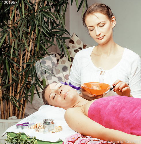 Image of stock photo attractive lady getting spa treatment in salon, healthcare people concept 