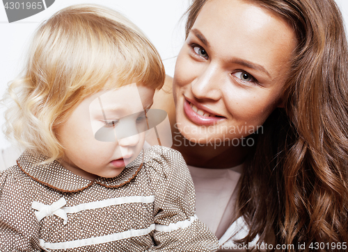 Image of young pretty stylish mother with little cute blond daughter hugging, happy smiling real family, lifestyle people concept