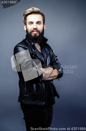 Image of portrait of young bearded hipster guy on gray dark background close up, brutal modern man, lifestyle people concept 