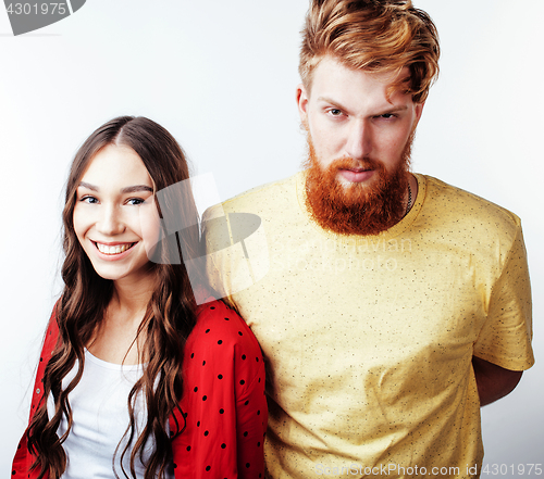 Image of young pretty teenage couple, hipster guy with his girlfriend happy smiling and hugging isolated on white background, lifestyle people concept