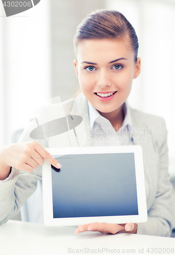 Image of businesswoman with tablet pc in office
