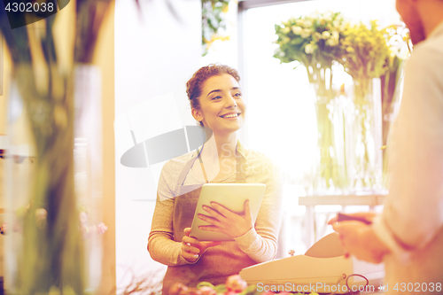 Image of florist woman and man making order at flower shop